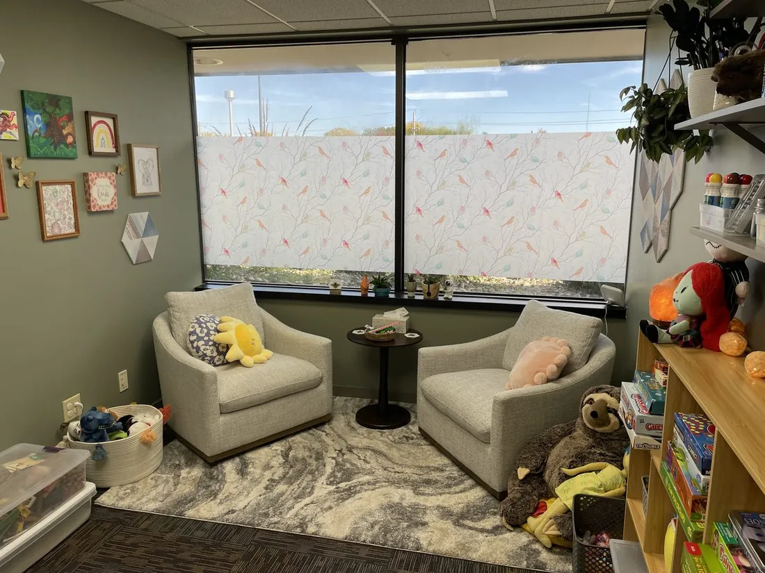 Office seating area beside a bright window